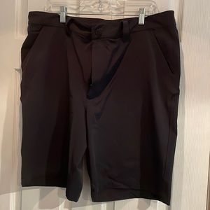 Under armour black golf shorts. Flat front. Size 38. Stretch fit